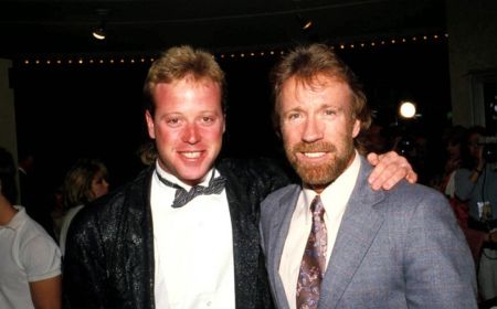 Chuck Norris with his first son Mike Norris at an event